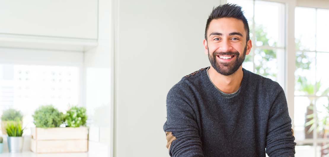 Preview image: PhD student smiles after submitting his dissertation